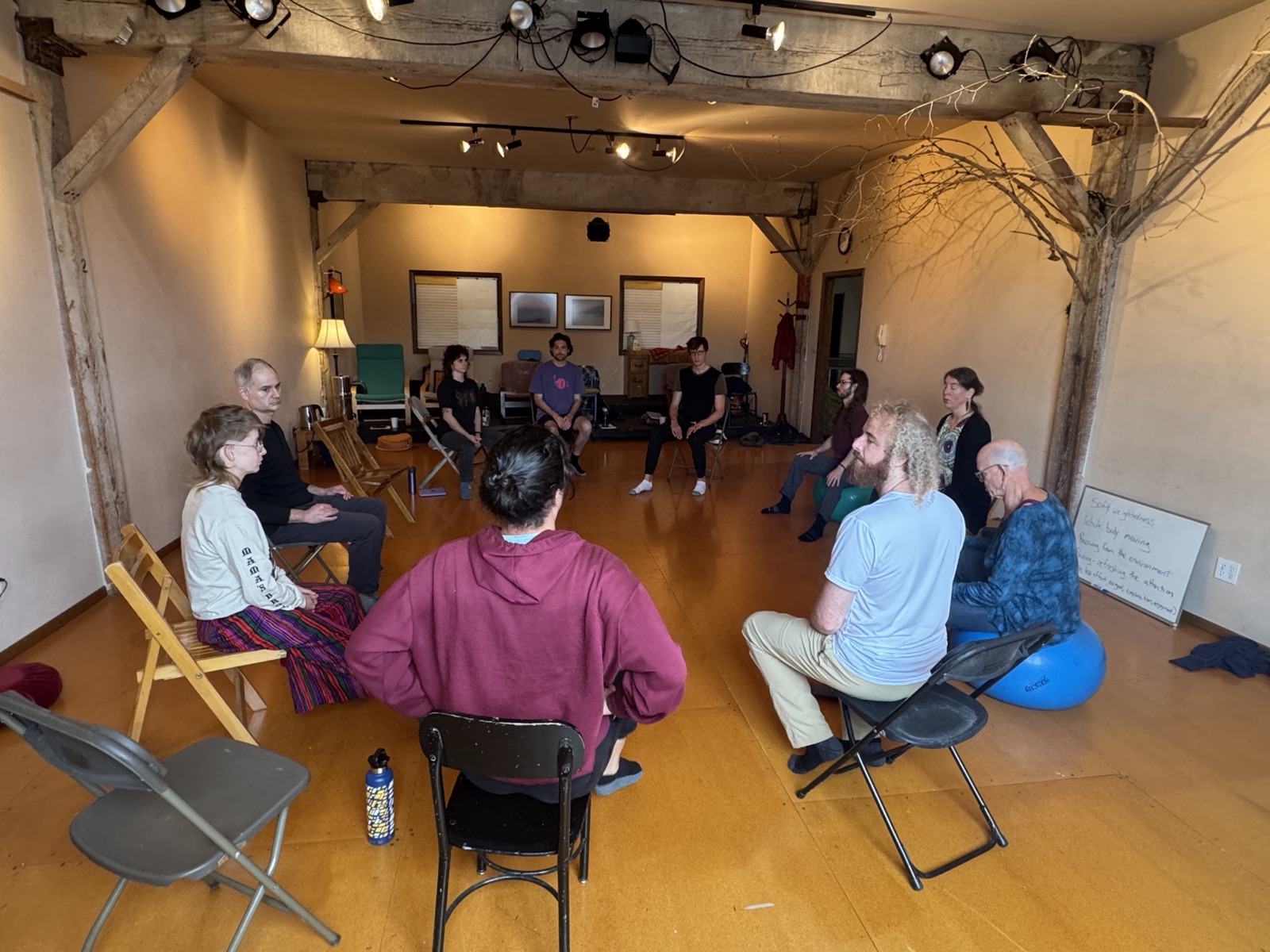 A study circle of students seated together at North Coast Seed Studios